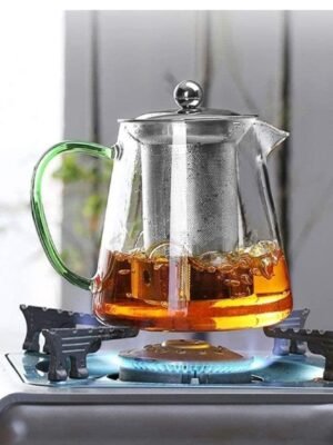 Théière en verre borosilicate avec filtre inox, idéale pour infusion sur flamme directe.